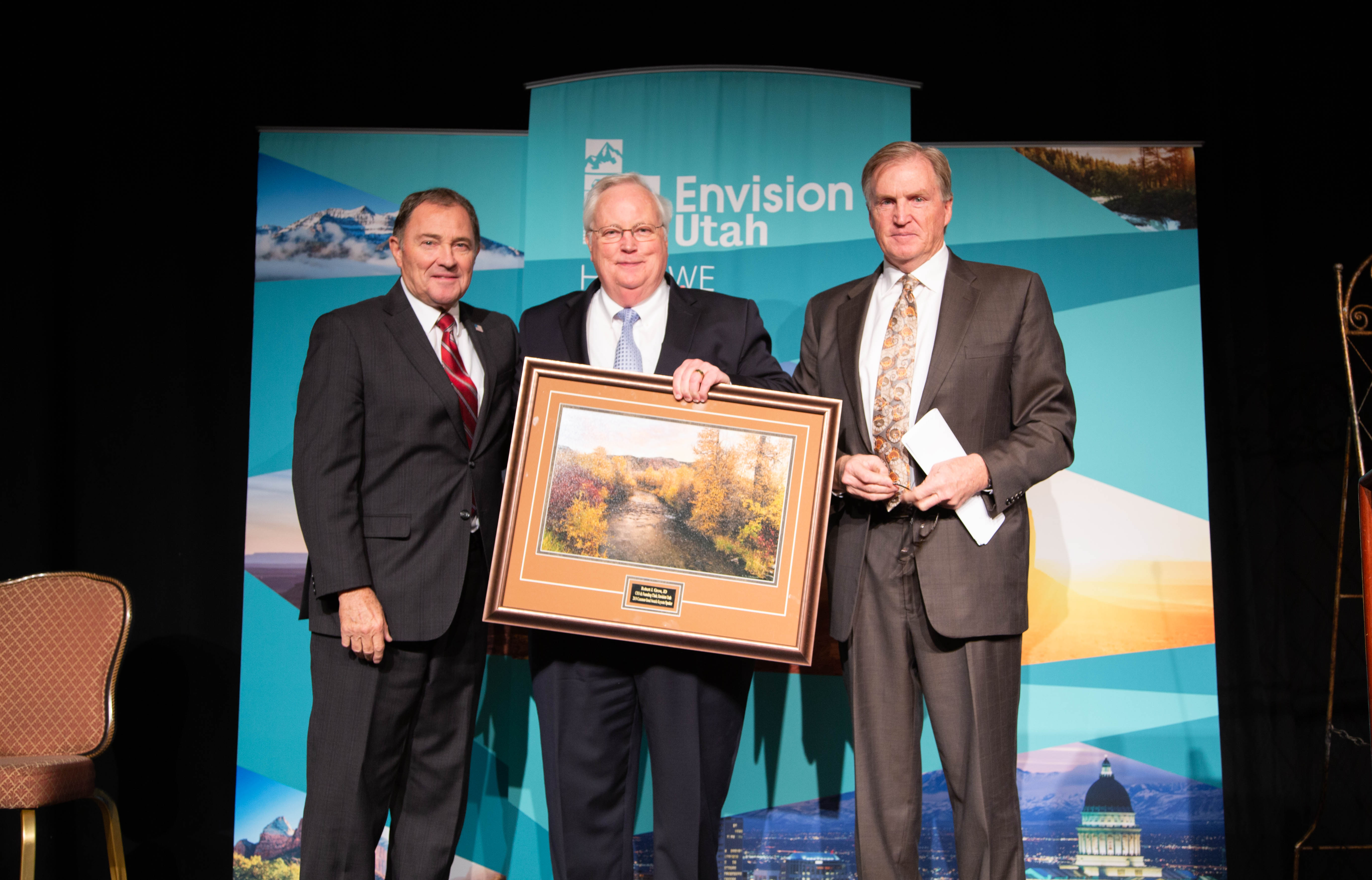 Utah Governor Gary Herbert, Envision Utah CEO Robert Grow and Jacobsen Board of Directors Chairman Lonnie Bullard (left to right) are pictured at the 2019 Common Good Awards luncheon at the Grand America Hotel in Salt Lake City. Bullard, who is also the chairman of Envision Utah's Executive Committee, emceed the luncheon.